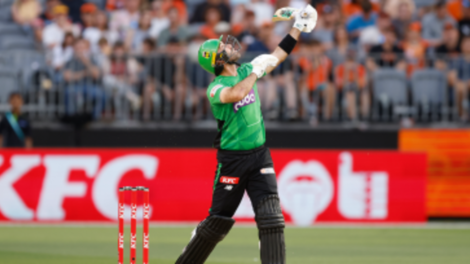 Glenn Maxwell launches a ball into the air