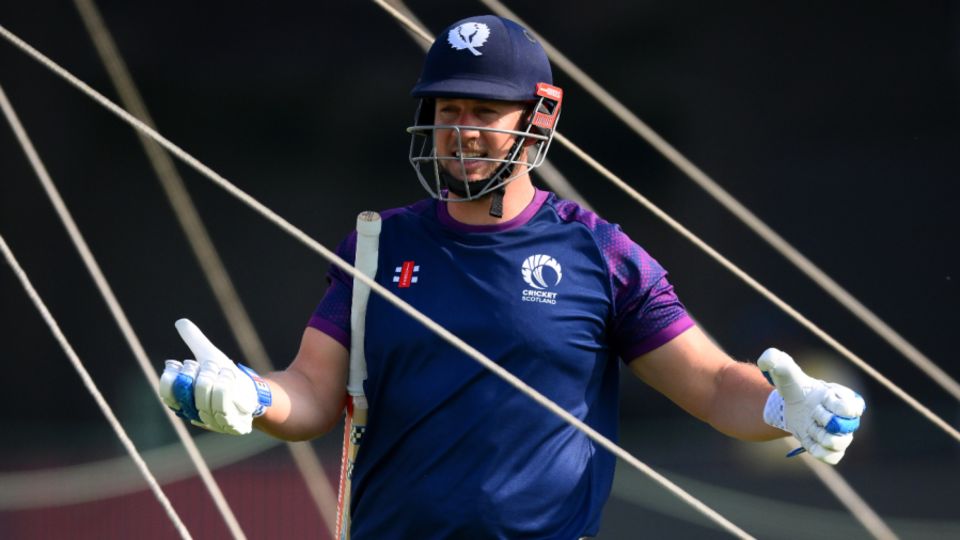 George Munsey gesticulates in the nets ahead of Scotland's opening match