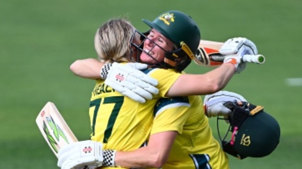 Beth Mooney congratulates Alyssa Healy after the latter's century