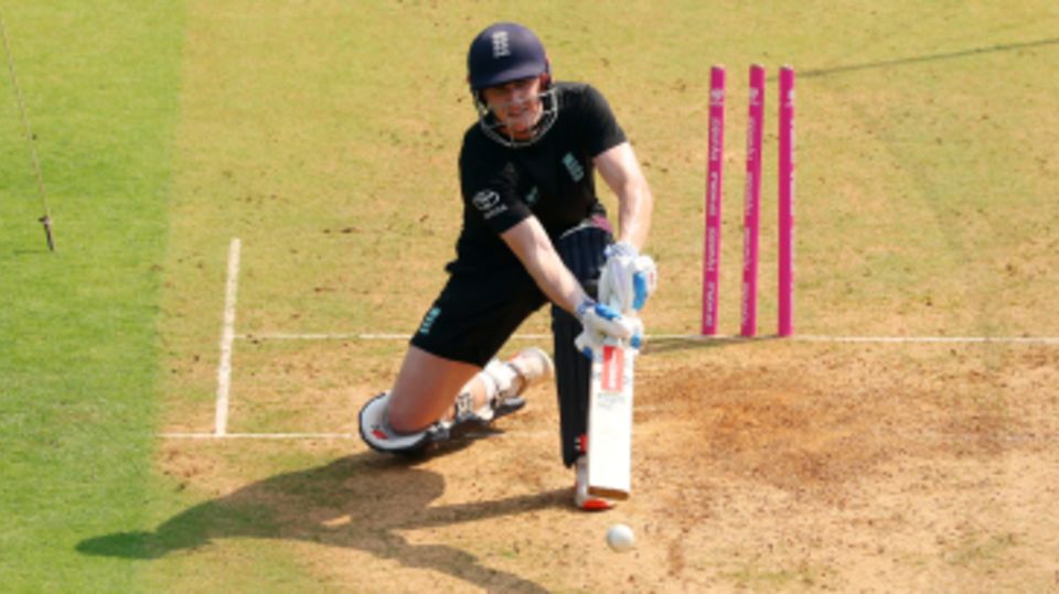 Harry Brook kneels into a scoop shot during training in Mumbai