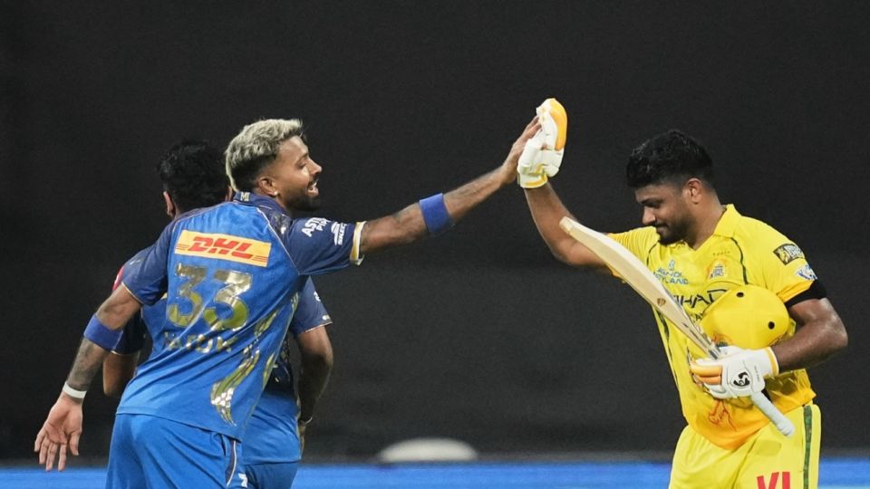 Sanju Samson gets a high-five from Hardik Pandya after his century