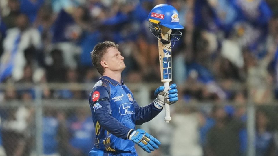 Ryan Rickelton raises his hundred - and his helmet