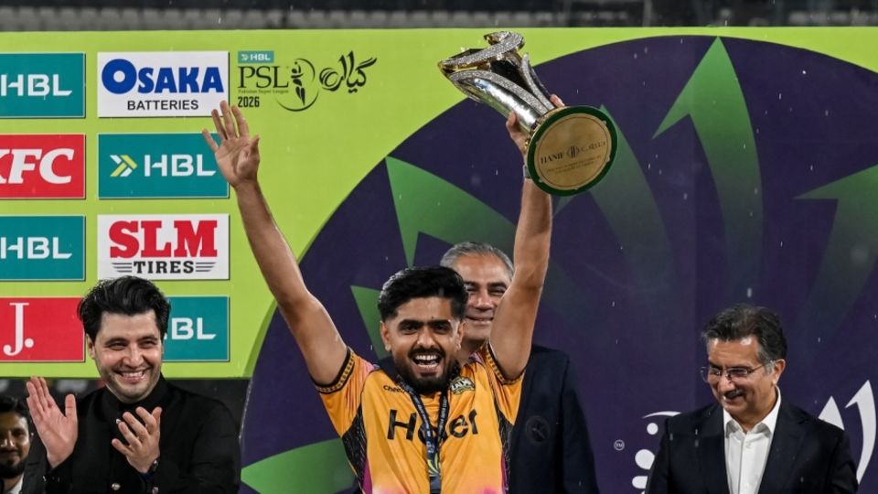 Babar Azam holds up the PSL trophy