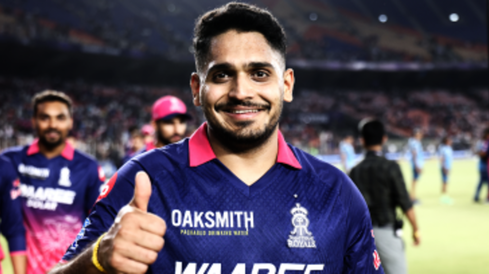 Tushar Deshpande gives a thumbs-up sign