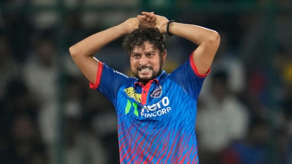 Kuldeep Yadav reacts after being hit for a six