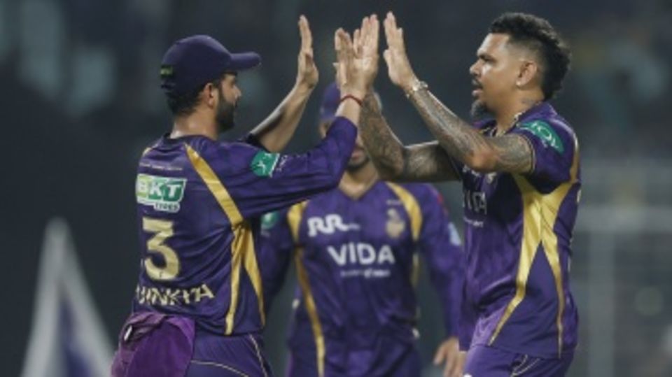 Sunil Narine celebrates a wicket with Ajinkya Rahane