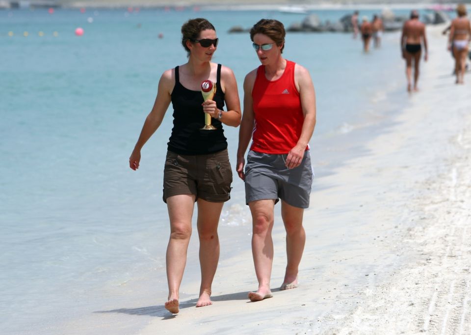 Beach belles: Edwards, armed with her ICC Women's Cricketer of the Year award, in Dubai with Claire Taylor in 2008