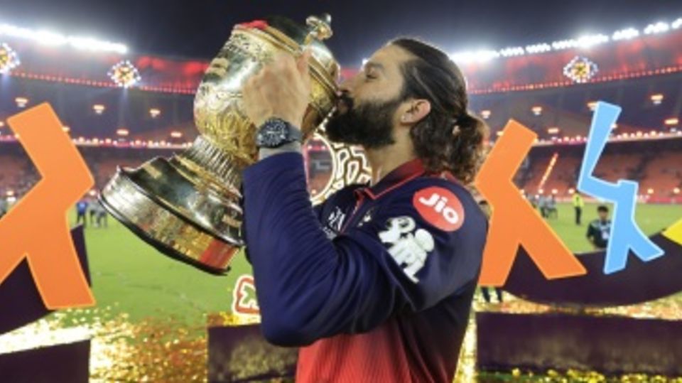 Rajat Patidar gives the IPL trophy a kiss