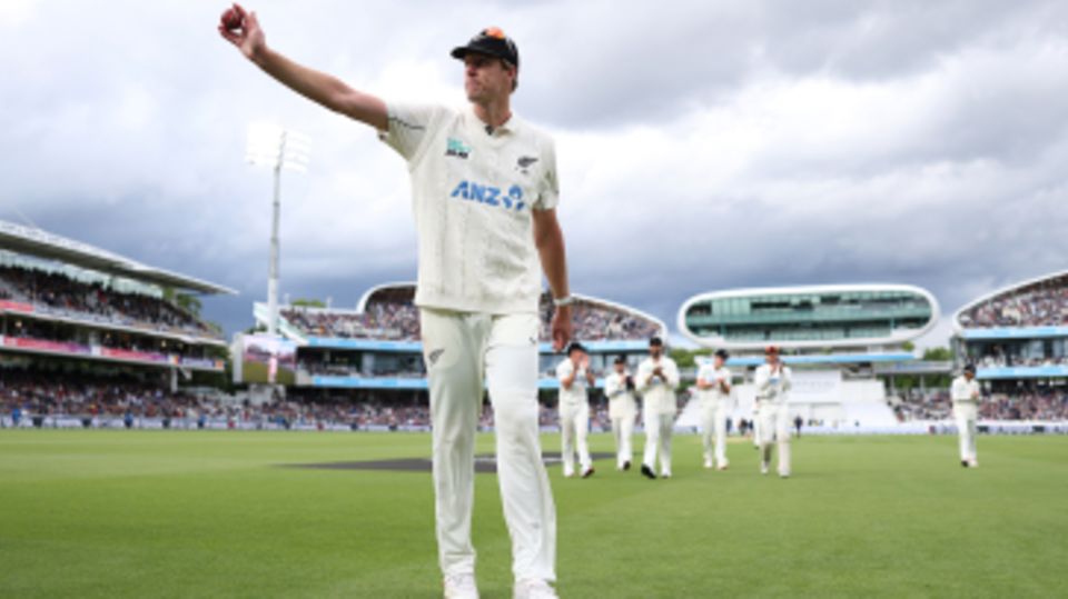 Kyle Jamieson holds the ball aloft after claiming a five-for
