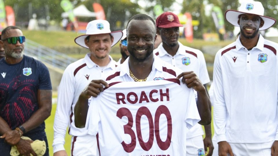 Kemar Roach is presented a West Indies Test shirt with the number 300 on it