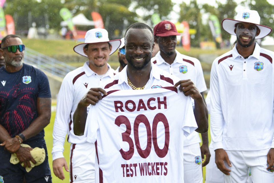 Kemar Roach is presented a West Indies Test shirt with the number 300 on it