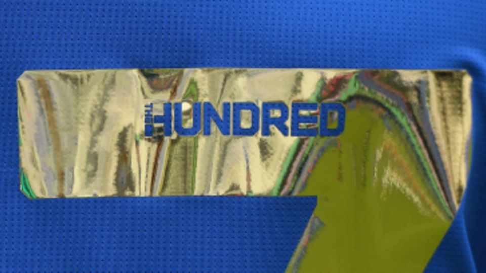 A close-up of the Hundred logo on a MI London shirt