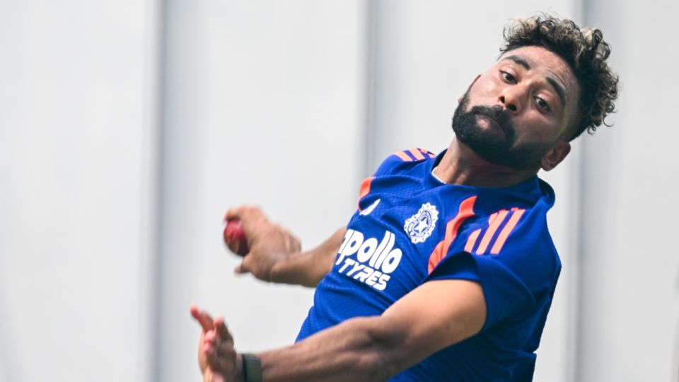 Mohammed Siraj bends his back during practice
