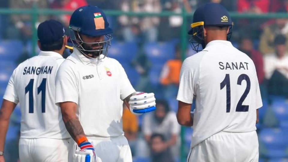 Sangwan in action for Delhi, alongside Kohli