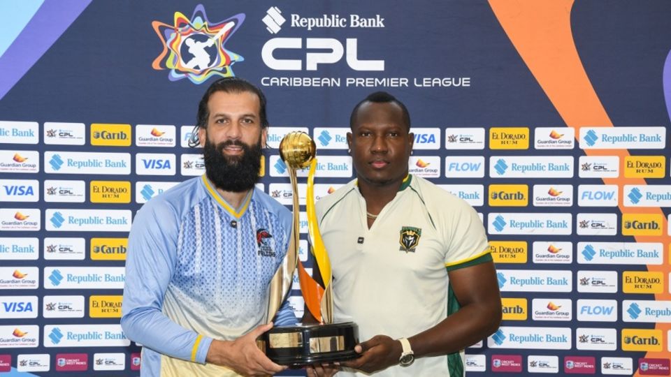 Antigua & Barbuda captain Moeen Ali and Jamaica Kingsmen captain Rovman Powell pose with the CPL trophy