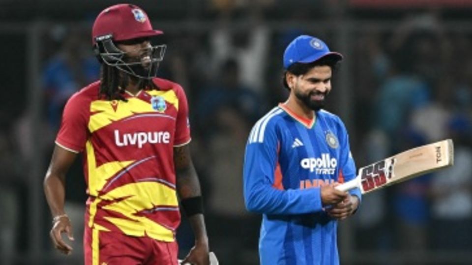 Shreyas Iyer looks at Shamar Springer's bat after he smashed an unbeaten 11-ball 35
