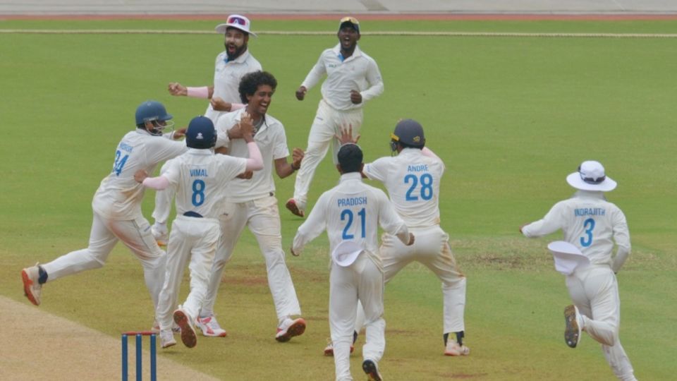 R Sai Kishore is mobbed by his team-mates after claiming a hat-trick