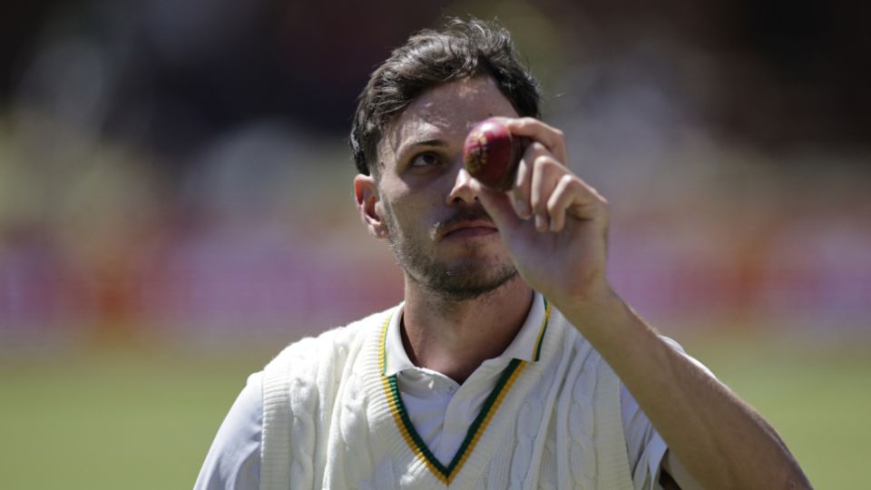 Marco Jansen celebrates with the ball after taking his five-for