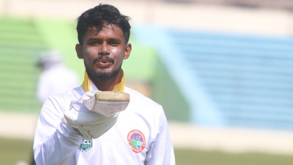 Nayeem Ahmed celebrates his century; he made an unbeaten 202