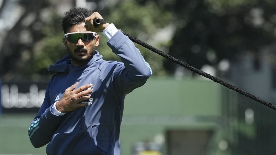 Axar Patel goes through his stretches