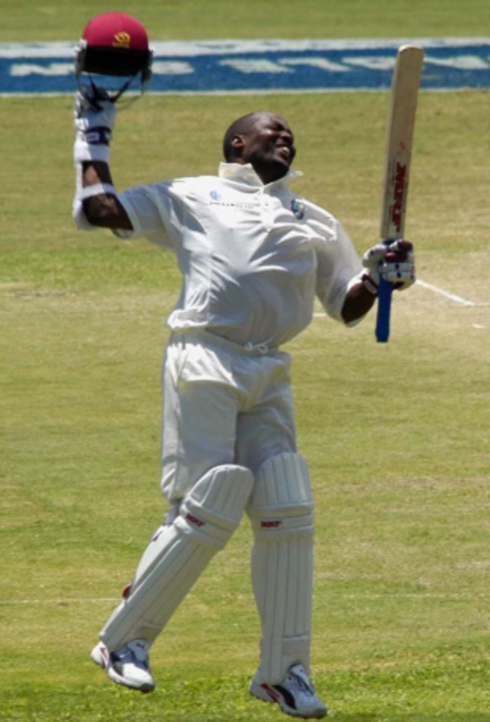Brian Lara leaps in delight after passing Matthew Hayden's record