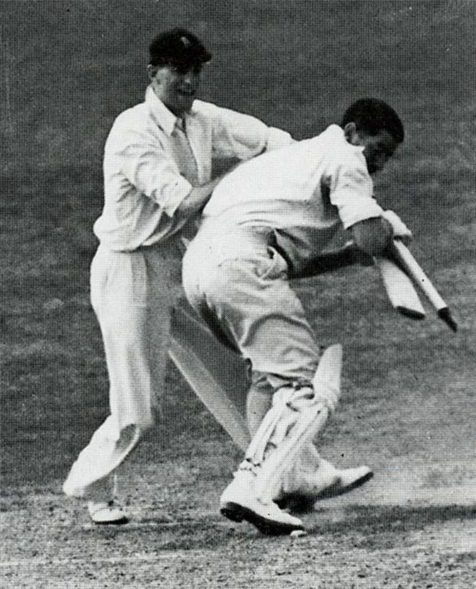 Len Hutton good-naturedly scraps with Chuck Fleetwood-Smith for a souvenir at the end of the Test