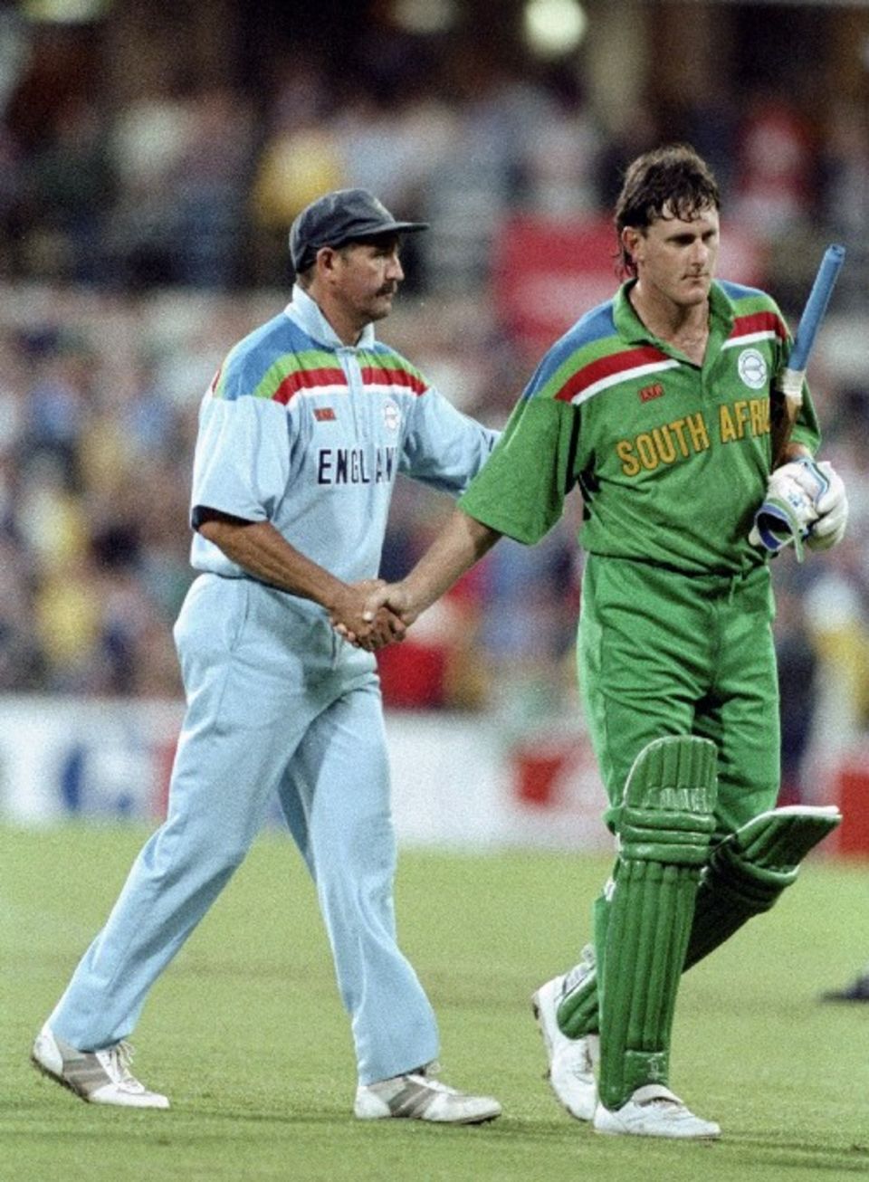 Graham Gooch consoles Brian McMillan as the players walk off the SCG