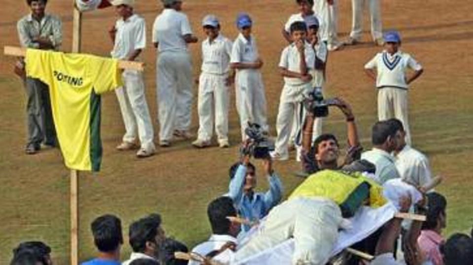 Indian fans march with an effigy of Ricky Ponting
