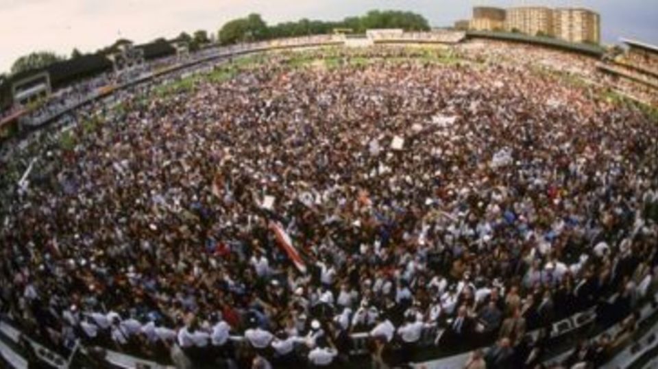 The crowd invades the ground after India's historic win