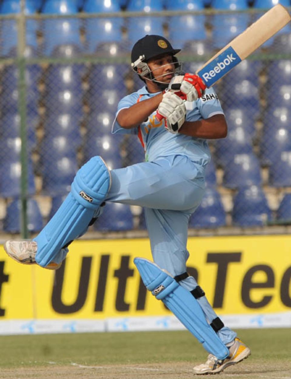 Rohit Sharma swivels on one foot to pull the ball