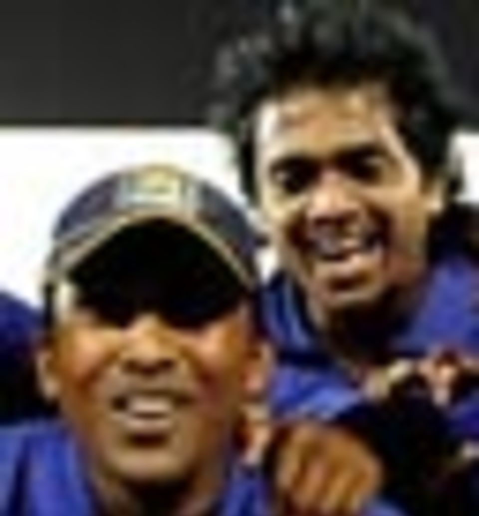 The Sri Lankan team pose with the trophy
