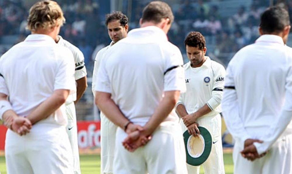 Players from both teams observe two minutes of silence