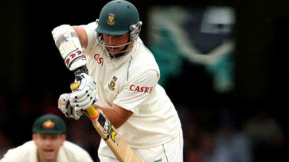 An injured Graeme Smith fends off a delivery