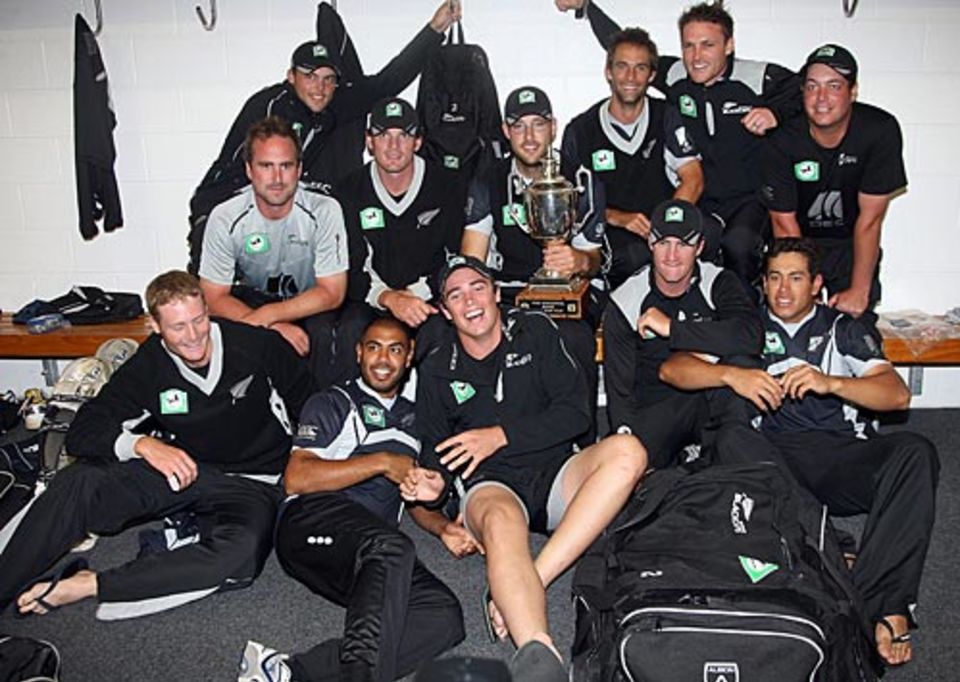 The New Zealand team celebrate in the dressing room after winning the ODI series 2-1