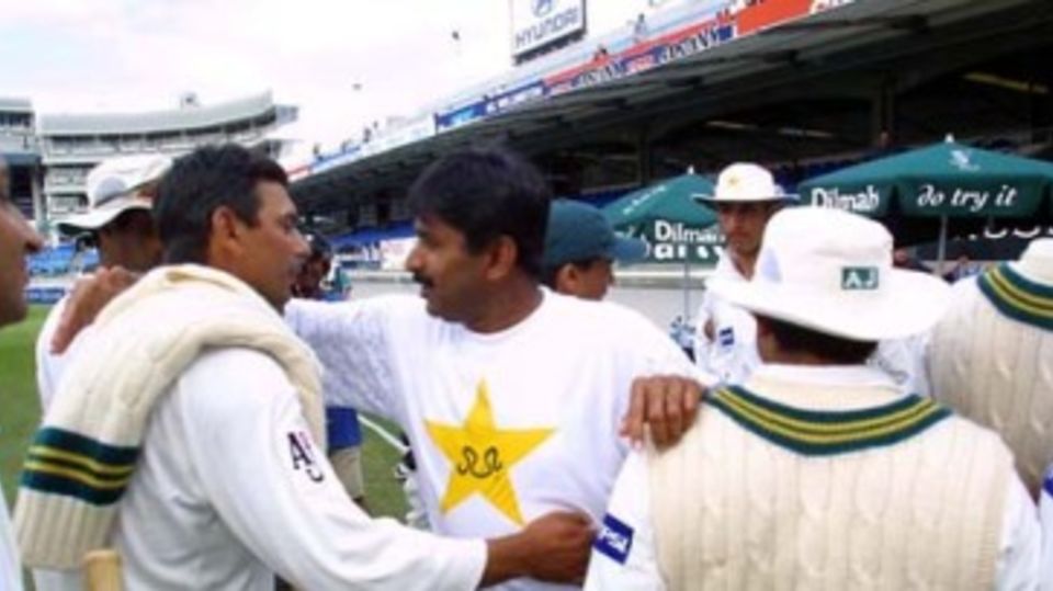 Saqlain is congratulated by coach Miandad after victory
