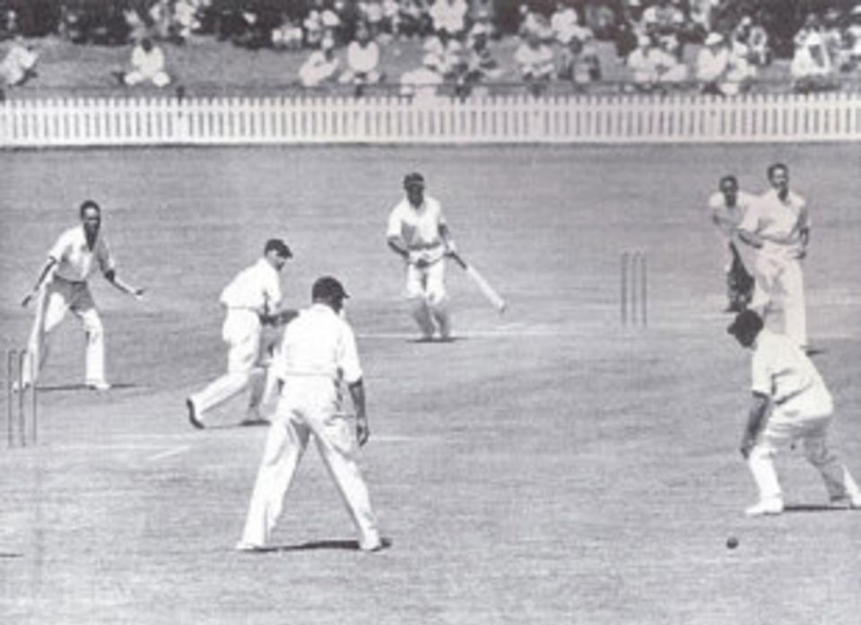 Bill Edrich runs the ball down to third man during his double hundred
