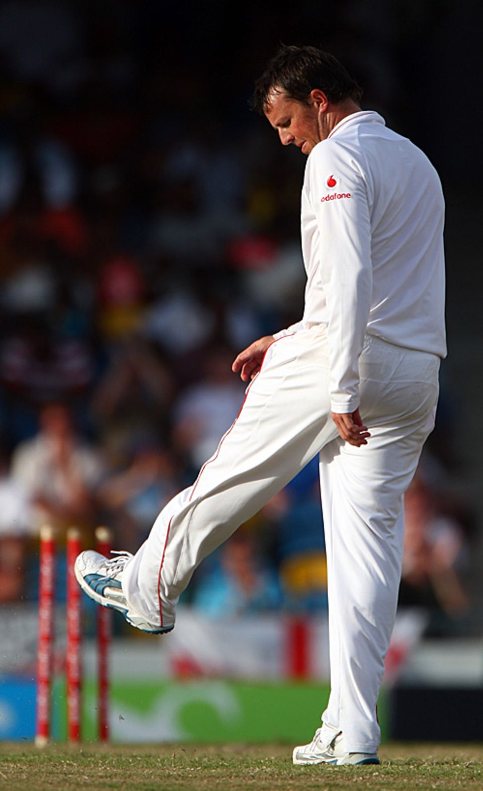 Graeme Swann kicks the turf in disgust