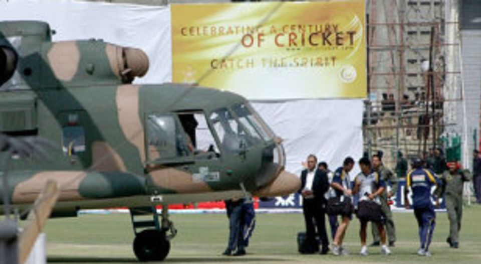 Sri Lankan cricketers prepare to board a Pakistani military helicopter at the National Stadium in Lahore following the terrorist attack