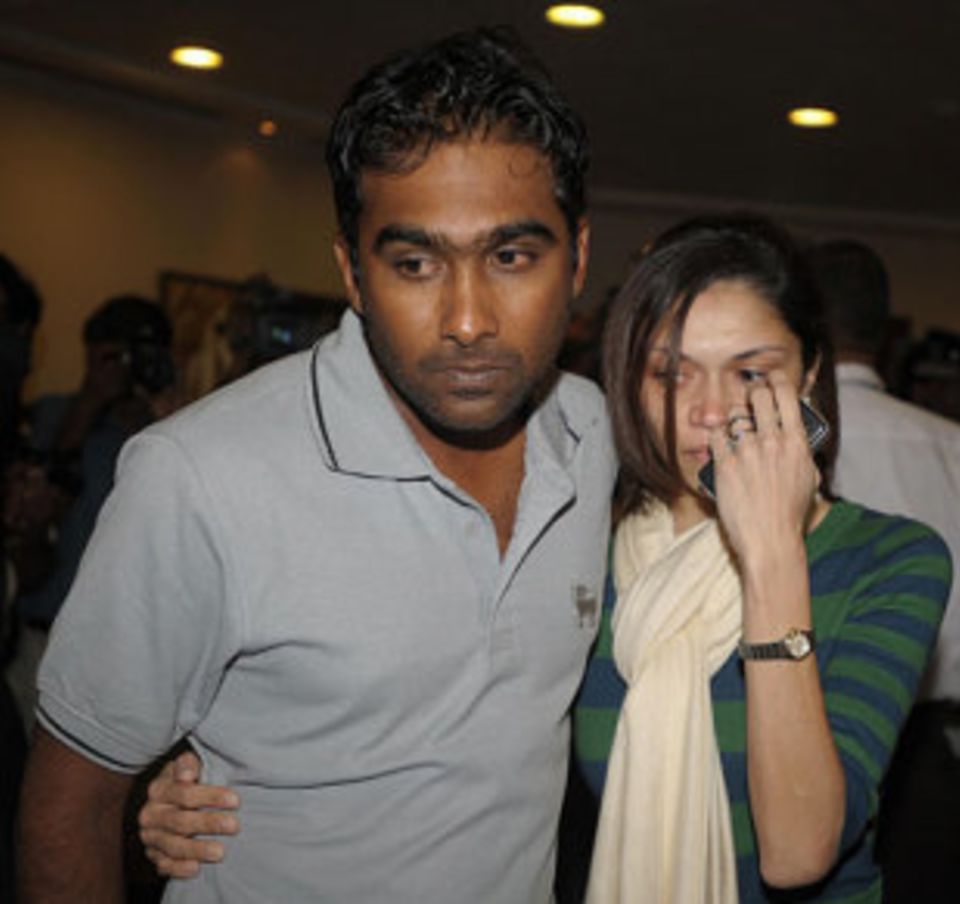 Mahela Jayawardene and his wife Christina leave Colombo airport after his arrival from Lahore