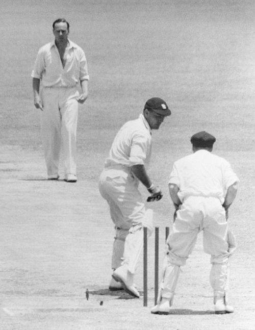 Alec Bedser turns to see that he has been clean bowled by Ian Johnson