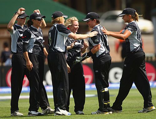 Lucy Doolan is congratulated for a wicket