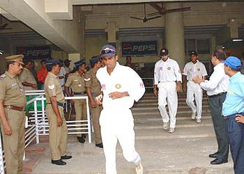 Nilesh Kulkarni walks out for his first Test in three years