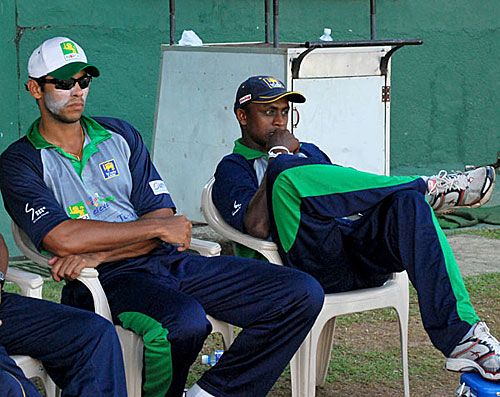 Michael Vandort and Ajantha Mendis watch a game in progress