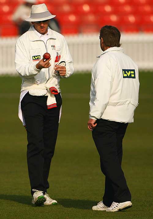 Umpires Michael Gough and Trevor Jesty inspect the Tiflex ball that will be used in Division Two