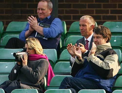 Peter Willey (far right) applauds his son's fifty on debut for Northamptonshire