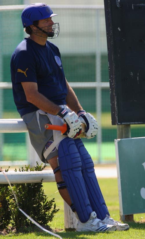 Tyron Henderson waits for his turn to bat at a practice session