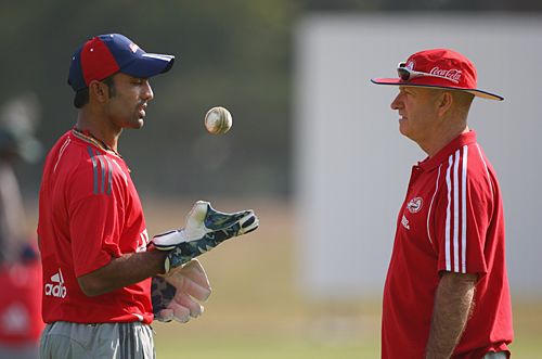 Greg Shipperd discusses a point with Dinesh Karthik at the nets