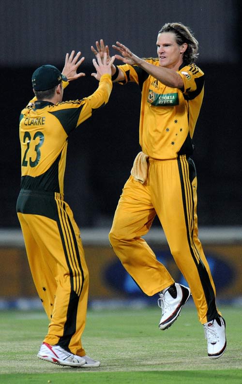 Nathan Bracken and Michael Clarke celebrate the wicket of Graeme Smith