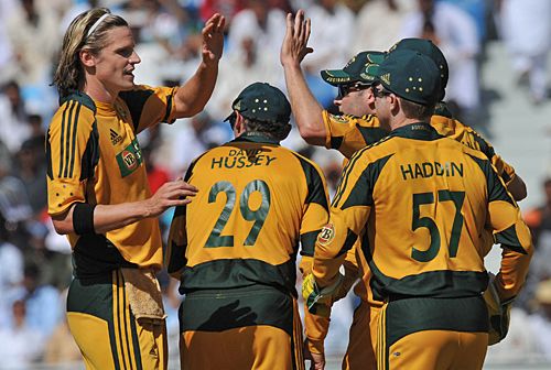 The Australians celebrate the fall of another Pakistan wicket