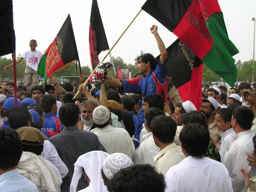 Man of the Match Aimal Wafa is lifted shoulder-high from the field